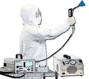 Technician performing dispersed oil particulate (DOP) testing on negative-air system