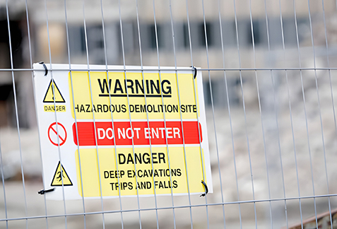 Environmental risk assessment – technician evaluating contaminated site for asbestos and hazardous materials