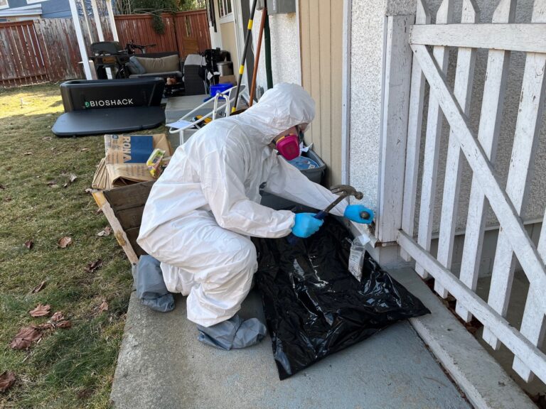 Epoch Environmental technician collecting bulk samples for hazardous materials testing in Kamloops, BC